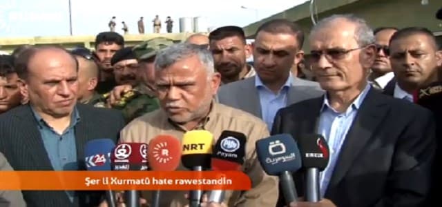 Shiite leader Hadi al-Amiri (centered) with the Kirkuk Governor Najmadin Karim (R)
