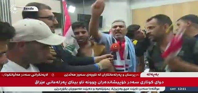 Angry protesters inside the parliament. Photo from Rudaw video.