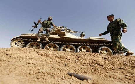Kurdish Peshmerga forces hold their position in the Iraqi village of Bashir. AFP File Photo.