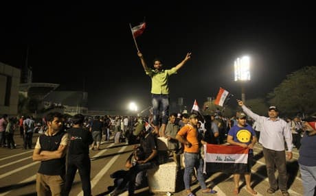 Protesters inside Baghdad's Green Zone after demonstrators broke into the parliament building earlier on Saturday. AFP photo. 