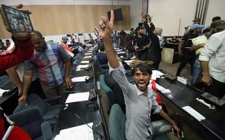 Angry protesters inside Iraqi Parliament on April 30. AFP Photo. 