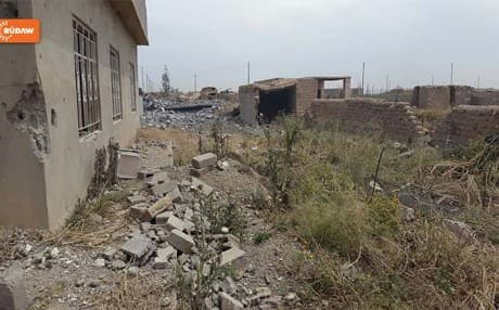 War-damaged houses in Bashir village.