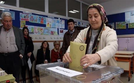 A woman casts her vote in  last November's elections in Turkey. AP file photo.