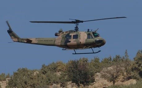 A Turkish Cobra helicopter flies over territory near the Iraqi border in this October 30, 2007 file photo. Photo: Burak Kara/AFP