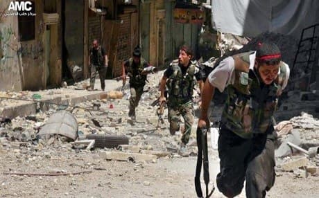 Syrian rebels amid heavy clashes with soldiers loyal to President Bashar Assad.  Photo: AMC/AP.