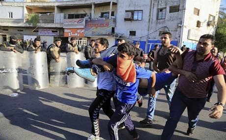 Iraqi protesters while storming into Baghdad's Green Zone. Photo: AP