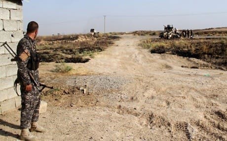     Iraqi troops and Turkmen Shiite fighters hold a position in Salahadin. AFP File Photo. 