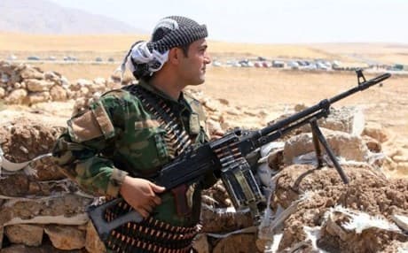  A Kurdish Peshmerga fighter takes up position in the town of Bashik, northeast of Mosul. AFP file photo 