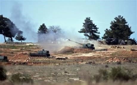 Turkish artillery guns near the border-town of Kilis. AP photo.