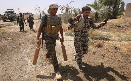 Iraqi soldiers and Shiite militia in Fallujah. AFP photo
