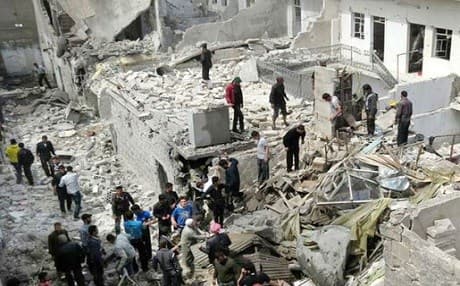 Residents of Aleppo search through the rubble in the aftermath of an attack in this AP file photo.