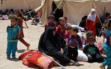 civilians from Fallujah flee their homes during a fight between Iraqi security forces and ISIS militants. 