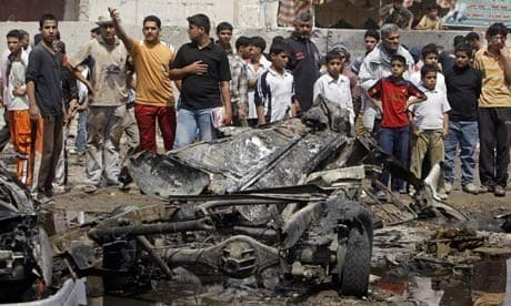 A crowd gathers at the site of a car bomb attack in the Sadr City neighborhood of Baghdad. AP file photo