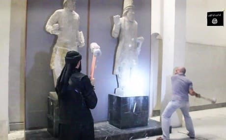 ISIS militants attack ancient artifacts with sledgehammers in the Nineveh Museum, Iraq. AP file photo