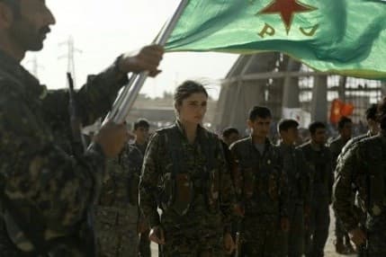 Kurds march in a funeral for comrades who died during the operation to take Manbij. Photo: Delil Souleiman/AFP