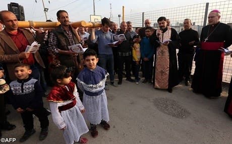 Iraqi Christians who fled Islamic State in Mosul attend prayers at Ashti camp in Erbil. Photo: AFP