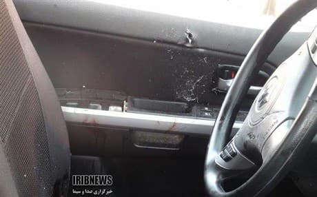 Bullet holes and blood on the door of the car Heshmatollah Falahatpishe was travelling in during the assassination attempt. Photo: IRIB News