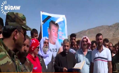 Mourners attend the funeral of Leland Stanford Scott. Photo: Rudaw/screengrab