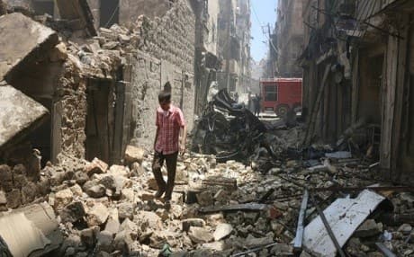A man walks through the rubble after an airstrike in rebel-held Aleppo in early June. Photo: Thaer Mohammed/AFP