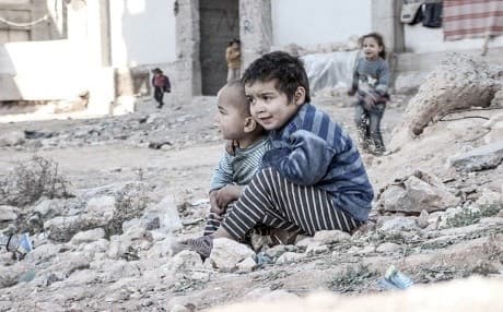 What kind of country will Syria’s children live in? Syrian children sit near a shelter for internally displaced persons in Aleppo. Photo: UNICEF