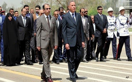 Iraq's Defense Minister Khaled al-Obeidi with Speaker of Parliament Salim al-Jabouri. AP file photo.