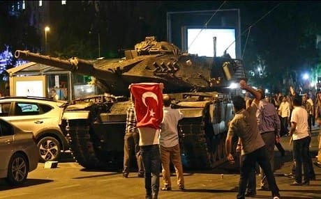 Turkish civilians stop one of the coup plotters tanks. July 15. AP file photo.