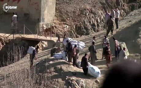Local villagers mainly from the Iranian side, have been carrying goods and commercial items to sell on both sides of the border. Photo: Rudaw