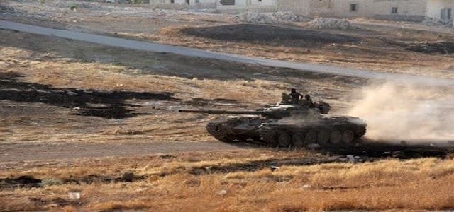 Syrian rebels drive a tank south of Aleppo as they fight to break the government siege on the city. Photo: Omar Haj Kadour/AFP