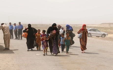 Iraqis flee Hawija, some 60km from Kirkuk, following the Islamic State group's advances. Photo: AFP
