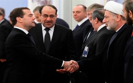 Iraq's Prime Minister Nuri Al-Maliki introduces his delegation members to Russian Prime Minister Dmitry Medvedev, left, prior to their meeting in the Gorki residence outside Moscow, Oct. 9, 2012. Photo: AP