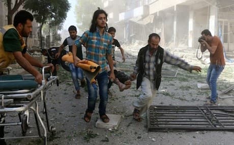 Volunteers evacuate a wounded person following reported air strikes in the rebel-controlled neighbourhood of Saleheen of the northern Syrian city of Aleppo. AFP file photo 