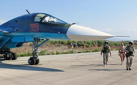Russian pilots check their Su-34 bomber in Hmeymim airbase, Latakia, Syria before a flight. Photo: EPA