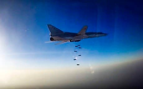 Russian Tu-22 supersonic bomber flying from Iran on Aug. 16 drops bombs over Syria's Aleppo region. AP photo.