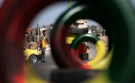 A security officer from the People's Defense Units (YPG) mans a checkpoint outside the city of Afrin. Photo: AFP