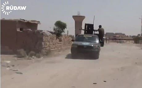 A YPG fighter in clashes with Syrian regime forces in Hasakah.