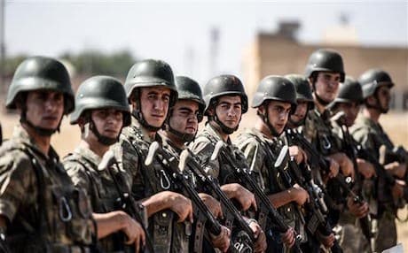 Turkish soldiers stand guard near the Turkey-Syria border post in Sanliurfa. AFP file photo