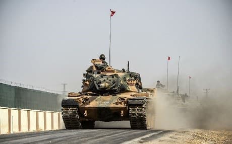 A Turkish army tank drives towards the northern Syrian town of Jarablus on Thursday. Photo: Bulet Kilic/AFP