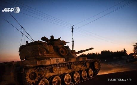 A Turkish tank returns to the border town of Karkamis from Jarablus. Photo: Bulent Kilic/AFP