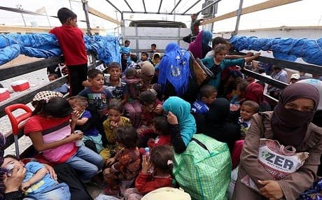 As the number of IDPs continues to swell, some are lucky enough to return to their homes. This group at the Debega camp crowds into a truck to return to villages newly liberated by the Kurdish Peshmerga. Photo: Rudaw.