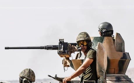 Turkish soldiers cross into Syria near the border town of Karkamis. Photo: Bulent Kilic/AFP