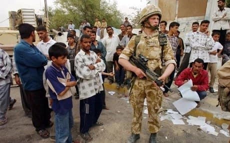 British forces in Basra struggling to control looting in the city developed their own tactics, including “wetting” – dowsing suspects with water or forcing them into water. Photo: Brian Roberts/AP