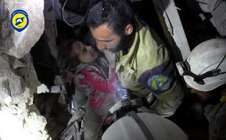 Volunteers with the White Helmets rescued Ghazal, the only survivor in airstrikes on Shaar, Aleppo on Wednesday that killed 24. Aleppo has been under heavy bombardment in the past week, allegedly carried out by Russian and Syrian planes. Photo: Syria Civil Defence/Twitter