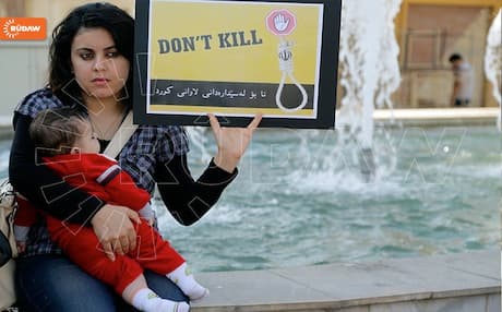 A Kurdish woman protesting against the execution of Kurdish prisoners in front of the Iranian consulate in Erbil.
