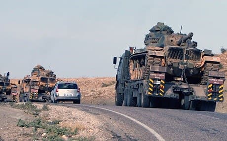Turkish tanks at the Turkey-Iraq border. Photo: Burhan Ozbilici/AP