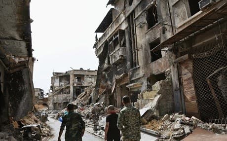 Syrian soldiers in war-torn Aleppo. AP Photo.