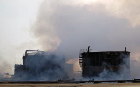 Smoke billows from the Mishraq sulphur factory after Islamic State (IS) group jihadists torched it, near the Qayyarah base,south of Mosul. Photo: AFP.
