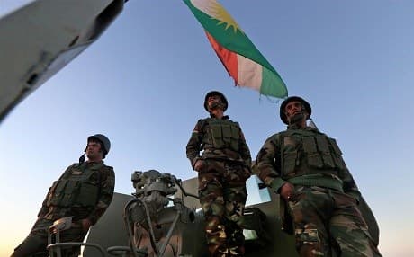 Iraqi Kurdish Peshmerga fighters atop Mount Zardak, about 15 miles east of Mosul.  Photo: AFP. 