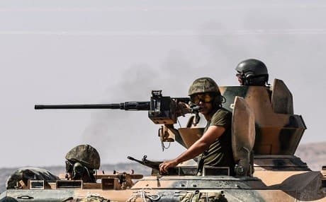 Turkish forces move into Syria as part of operations against the Kurdish People's Defense Units and ISIS fighters last August. Photo: AFP