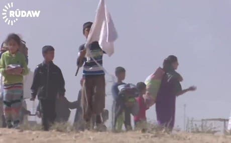 Iraqi children flying white flags flee the fighting. Photo: Rudaw video