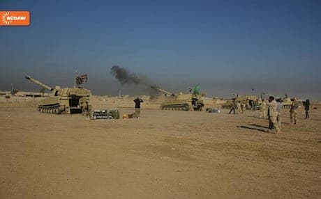 Iraqi army tanks positioned near Intisar neighborhood, southeastern Mosul.